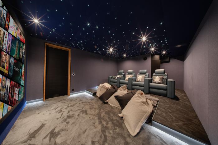 Cozy cinema room with starry sky ceiling at Chalet Orso in Val d-Isere.