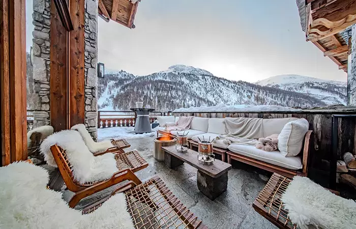 Outdoor terrace lounge with mountain views at Chalet Orso in Val d-Isere