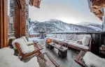 Outdoor terrace lounge with mountain views at Chalet Orso in Val d-Isere
