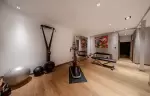 Modern fitness room with exercise equipment at Chalet Orca in Val d-Isere.