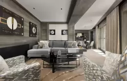 The living and dining room of a Grand Luxury Suite at Le K2 Chogori, Val d'Isere
