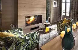 Deluxe Room 4 with leaf-print armchairs in front of the bed, Lys Martagon, Courchevel 1850