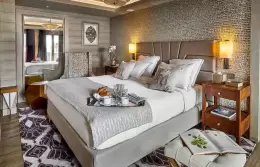 Junior Suite 2 bedroom with a tall headboard and bedside lamps, Lys Martagon, Courchevel 1850