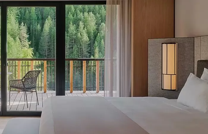 Premiere suite with a forest view at Rosa Alpina.