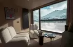 Lounge armchairs by the bay window with mountain view at Fahrenheit Seven Les Menuires