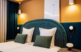 Superior Room with a terracotta headboard and a balcony door at Barma Hotel & Spa, La Tania