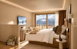 Deluxe Room with a king-size bed, a television and a window onto the peaks at Barma, La Tania