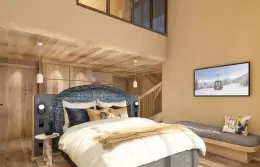 Lower level of a Duplex Family Room under a double-height ceiling at Barma, La Tania