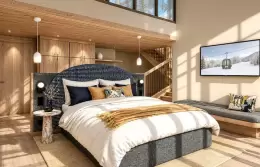 Lower level of a Duplex Family Room under a double-height ceiling at Barma, La Tania