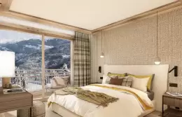Bedroom with a window onto the mountains in a Superior Apartment at Barma Residence, Courchevel La Tania