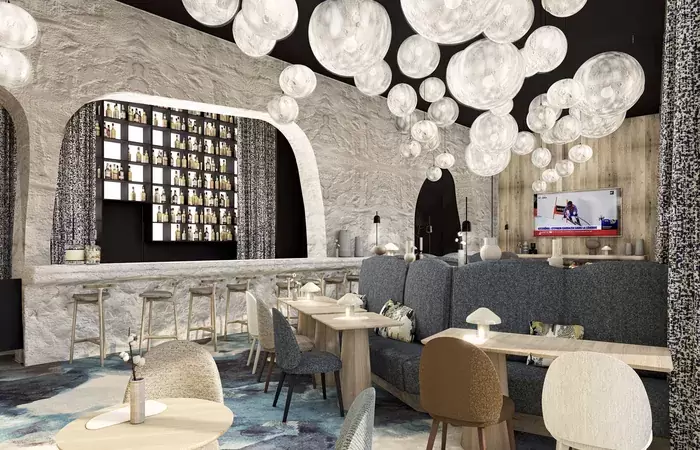 Bar with glass globe lights and a stone-effect counter at Barma, Courchevel La Tania