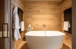 A freestanding bathtub in a Master Suite bathroom at Hotel Hermitage, Breuil-Cervinia