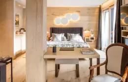 The bedroom and desk of a Master Suite at Hotel Hermitage, Breuil-Cervinia