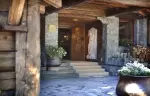 The stone entrance steps and wooden porch at Hotel Hermitage, Breuil-Cervinia