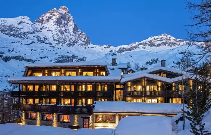 The hotel lit at dusk below the Matterhorn, Hotel Hermitage, Breuil-Cervinia