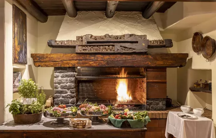 The open grill hearth of the La Chandelle restaurant, Hotel Hermitage, Breuil-Cervinia
