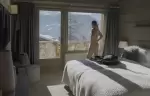 A bright bedroom with a glass door to the balcony at No. 14 Verbier