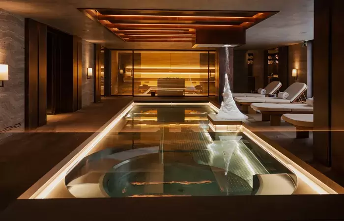 Loungers along the indoor pool in the private spa at No. 14 Verbier