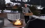 The terrace with a lit fire pit and lounge chairs at No. 14 Verbier