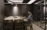 The dining table beside glass wine cabinets at No. 14 Verbier